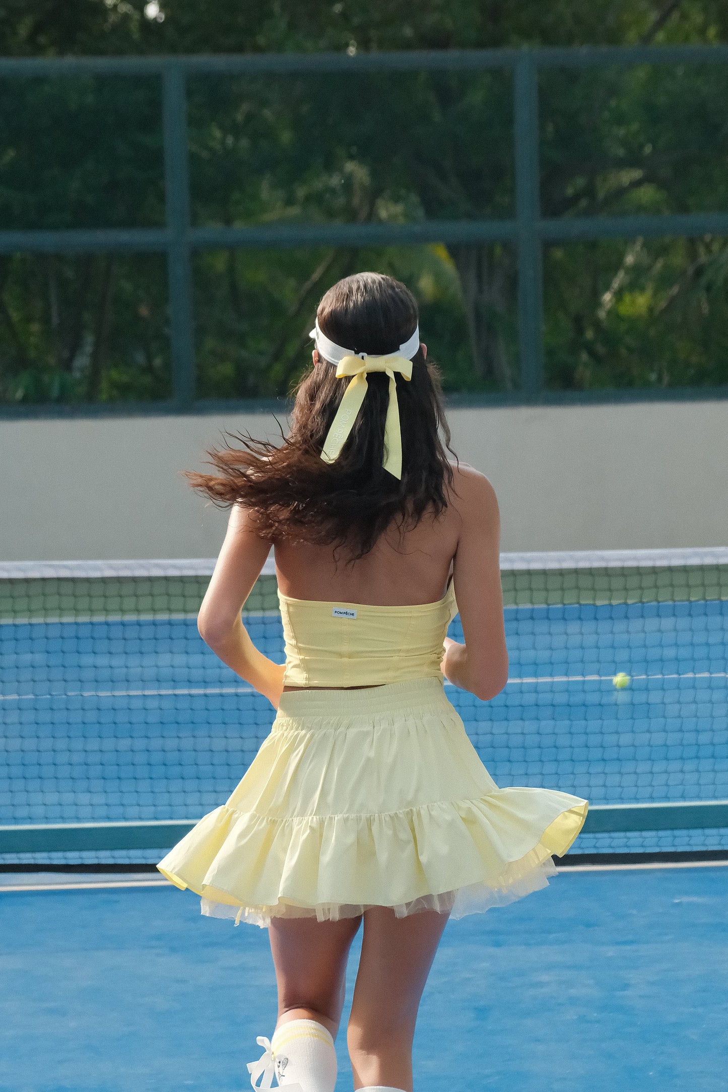VICKY Falda de tenis amarilla abullonada con bolsillo 2 en 1 y malla con lazo