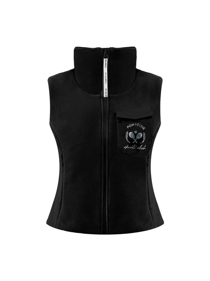 Warm black fleece vest with high-neck zip design and embroidered chest pocket, styled on the tennis court.