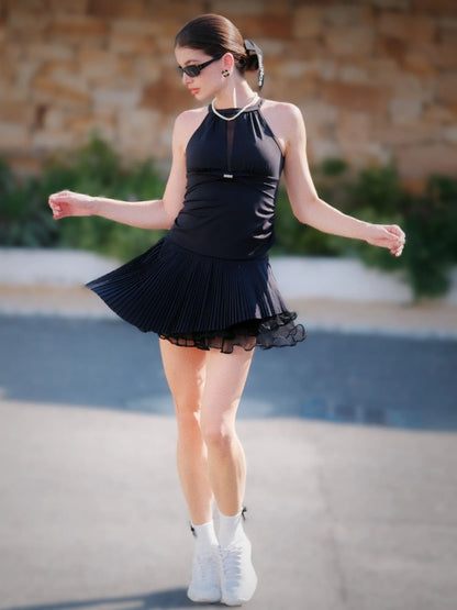 Woman in mesh halter tank - black